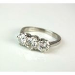 A platinum three stone synthetic diamond ring