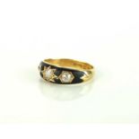An 18ct gold three stone mourning ring
