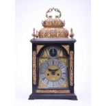 A fine and rare early 18th century ebonised quarter repeating double basket top bracket clock