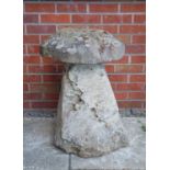 Two antique cut weathered limestone staddle stones and caps