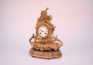 A French Louis XV style gilt metal mantel clock