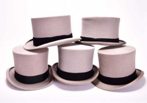 A group of five various grey wool felt top hats