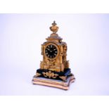 A French neoclassical gilt metal mantel clock