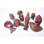 A group of seven Achatit wall masks