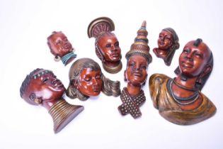 A group of seven Achatit wall masks
