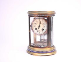 A French gilt brass and champleve enamel mantel clock