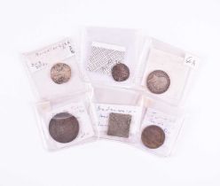 Four Irish coins and tokens