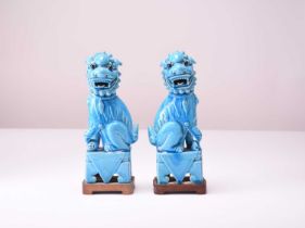 A pair of Chinese turquoise-glazed figures of guardian lions