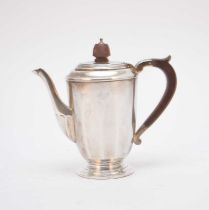 A silver coffee pot