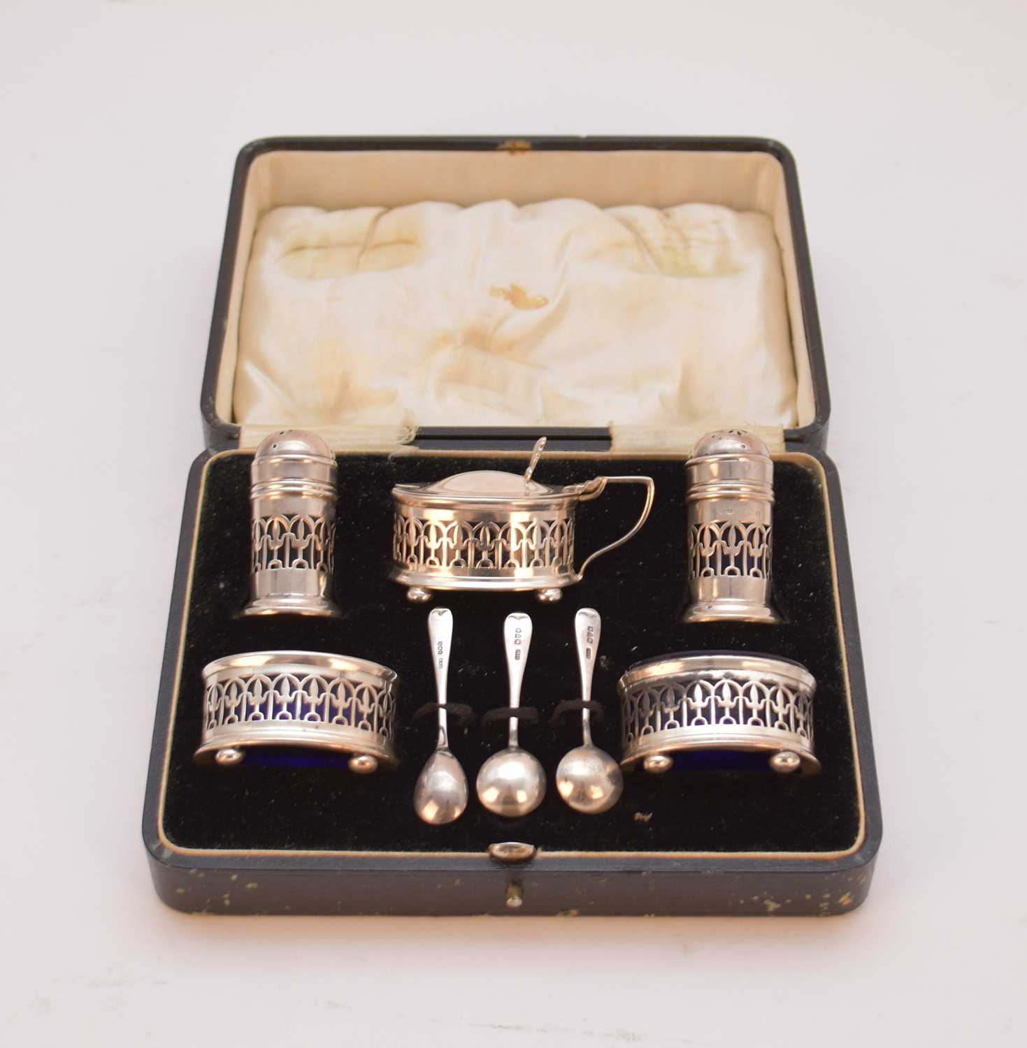 A cased five piece silver cruet set