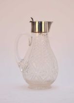 A silver mounted glass claret jug