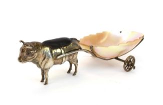 An Edwardian novelty silver pin cushion in the form of a bull with a mother of pearl cart