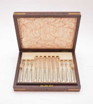 An early 20th century cased set of silver dessert knives and forks