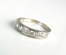 A seven stone diamond half eternity ring