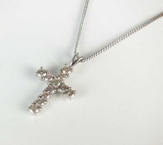 An 18ct white gold diamond set crucifix pendant