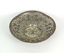 A white metal decorative pierced bowl
