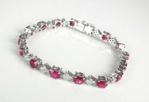 An 18ct white gold ruby and diamond bracelet