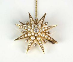 An early 20th century diamond and split seed pearl starburst pendant / brooch