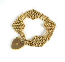 A yellow metal gate link bracelet