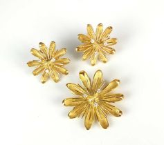 A diamond set stylised flower brooch / pendant with matching earrings