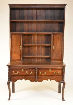 A George III oak cross-banded dresser and rack