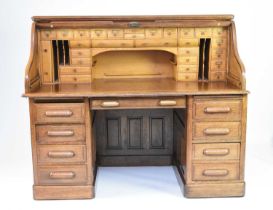 A 20th century oak roll-top pedestal desk