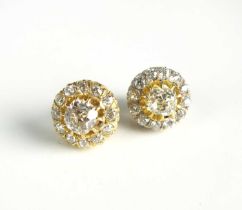 A pair of diamond cluster earrings