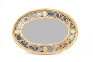 A Regency revival giltwood and gesso oval overmantel mirror, 19th century