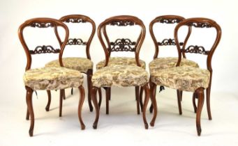 A set of six Victorian rosewood balloon back dining chairs