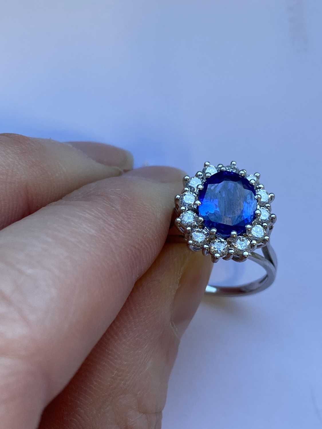 An oval sapphire and diamond cluster ring - Image 3 of 9