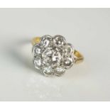 A diamond floral cluster ring