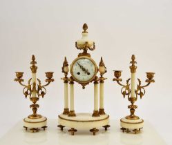 A late 19th century French Portico clock garniture