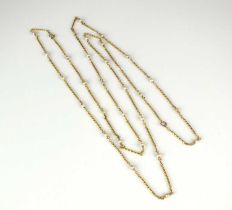A yellow metal seed pearl set chain