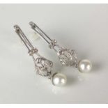 A pair of early 20th century style diamond and cultured pearl ear pendants