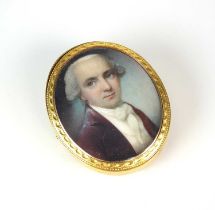 An early 19th century ivory miniature brooch / pendant