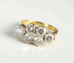 An 18ct gold seven stone diamond dress ring