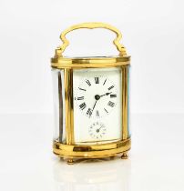 A French brass oval carriage alarm clock, early 20th century