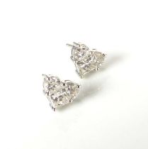 A pair of 18ct white gold diamond earrings of heart form