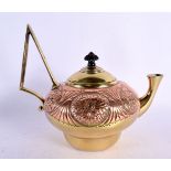 AN ARTS AND CRAFTS COPPER AND BRASS TEAPOT decorated with floral roundels. 24 cm x 21 cm.