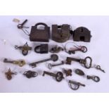 A COLLECTION OF 18TH/19TH CENTURY MIDDLE EASTERN AND INDIAN LOCKS & KEYS. Largest 9 cm x 11 cm. (qty