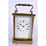 AN ANTIQUE BRASS CARRIAGE CLOCK. 17 cm high inc handle.