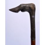 A 19TH CENTURY MIDDLE EASTERN CARVED RHINOCEROS HORN HANDLED SWORD STICK. 87 cm long.