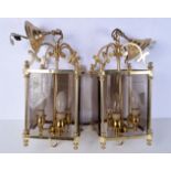 A pair of heavy brass and bevelled glass ceiling lights 55 cm
