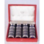 A CASED SET OF CARTIER CONDIMENTS. Silver 46 grams. 6.75 cm x 2.5 cm. (4)