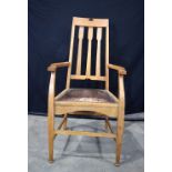 A Thompson Edwards and Sons Newcastle Oak armchair with Label to underneath 110 x 58 x 47 cm.