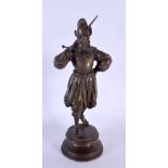 AN ANTIQUE FRENCH BRONZE FIGURE OF A MEDIEVAL SOLDIER modelled holding a sword. 23 cm high.