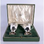 A CASED SILVER CHRISTENING JUG AND VASE. Birmingham 1913. 209 grams. 14 cm x 6.5 cm. (2)