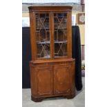 A mid-Century glass fronted mahogany corner cabinet. 179 x 92 x 52cm.