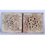 AN UNUSUAL PAIR OF 19TH CENTURY MIDDLE EASTERN MARBLE TILES carved with foliage and stars. 25 cm squ