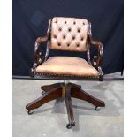 A Norwegian Mekkanik wood and leather swivel chair 80 x 50 x 62 cm.